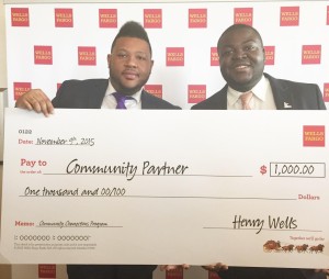 Youth Action receives $1,000 check from Wells Fargo's Community Connection program. Pictured here is (l-r) Joseph Mackie, Branch Manager for Wells Fargo at 20th and Market in Philadelphia and Anthony Phillips Managing Director for Youth Action. Mackie nominated Youth Action for the Wells Fargo grant. 