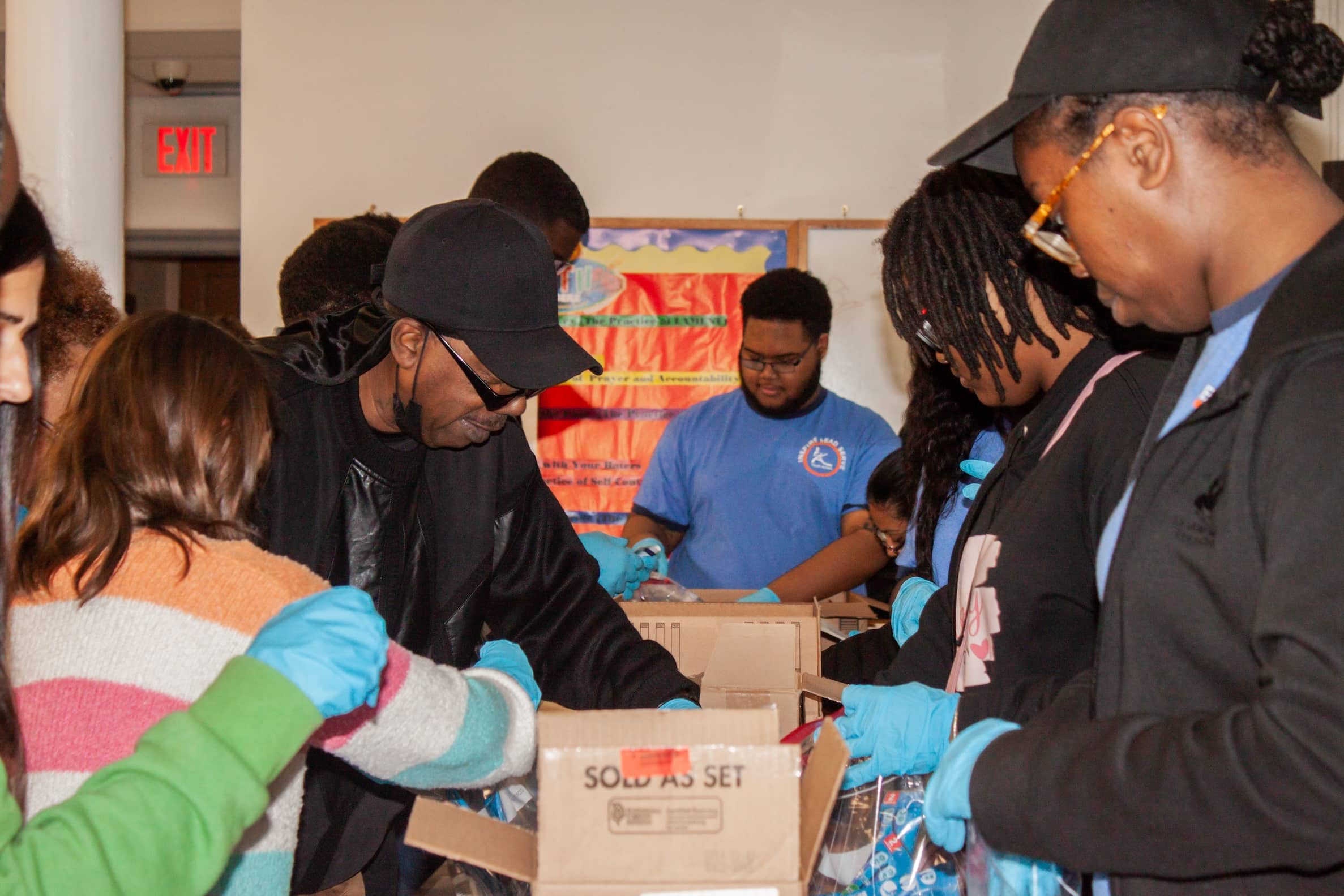 Youth Action 2024 MLK Day of Service group packing care items for the unhoused