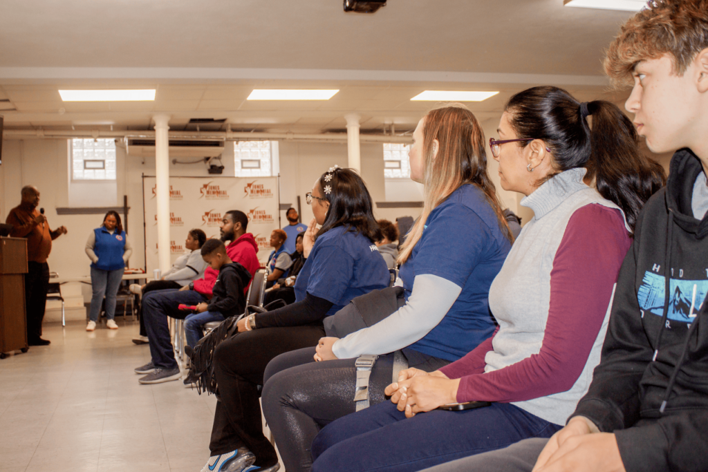 Hosts speaking at Youth Action's 2024 MLK Day of Service