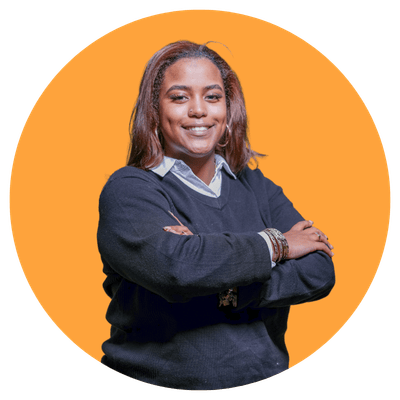 Person with arms crossed, orange background