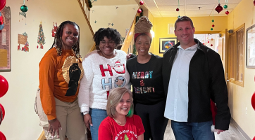 Group photo of Youth Action team members with Red Cross House's Yaly Alvarez